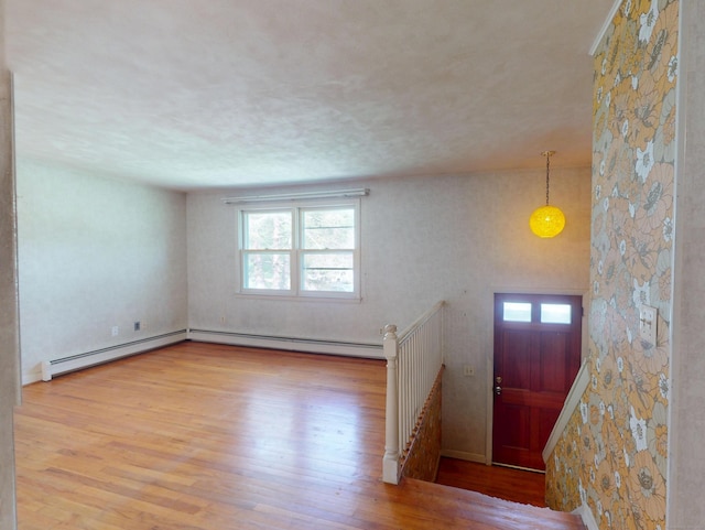35 Corey Ln, East Lyme, CT 06357 - entryway featuring plenty of natural light, baseboard heating, and wood finished floors