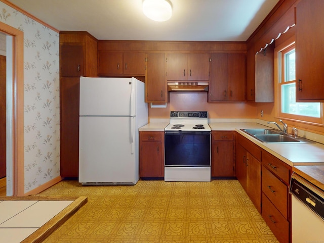 35 Corey Ln, East Lyme, CT 06357 - kitchen featuring white appliances, premium range hood, light countertops, brown cabinetry, and light floors