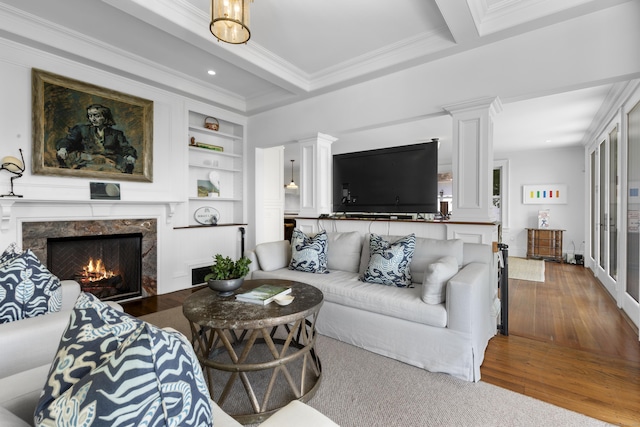 1 Foxboro Rd, Essex, CT 06426 - living room with crown molding, hardwood / wood-style flooring, a premium fireplace, built in shelves, and recessed lighting