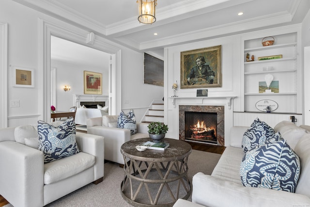 1 Foxboro Rd, Essex, CT 06426 - living area with a fireplace, ornamental molding, built in shelves, and recessed lighting