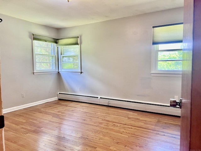 239 Bates Dr, Cheshire, CT 06410 - unfurnished room with a baseboard heating unit and wood finished floors
