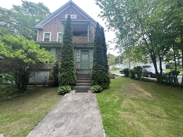 578 Columbia Boulevard Extension, Waterbury, CT 06704 - view of front of home featuring brick siding and a front yard