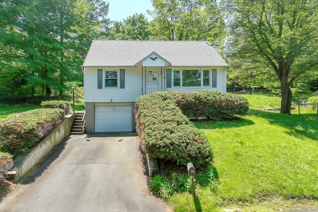 510 Sylvan Lake Rd, Watertown, CT 06779 - view of front facade with asphalt driveway, an attached garage, and a front lawn