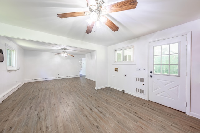 510 Sylvan Lake Rd, Watertown, CT 06779 - foyer entrance with a baseboard radiator, wood finished floors, stairs, and ceiling fan