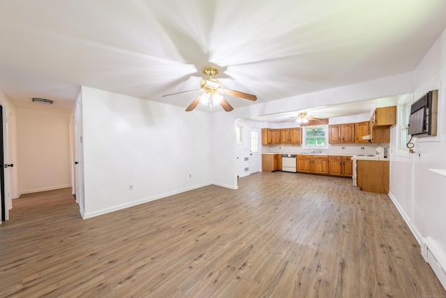 510 Sylvan Lake Rd, Watertown, CT 06779 - unfurnished living room featuring a ceiling fan and light wood finished floors