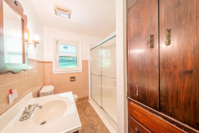 510 Sylvan Lake Rd, Watertown, CT 06779 - full bath with a shower stall, vanity, tile patterned floors, a wainscoted wall, and tile walls