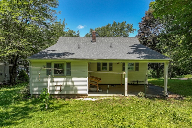 510 Sylvan Lake Rd, Watertown, CT 06779 - back of property with a chimney, a lawn, and roof with shingles
