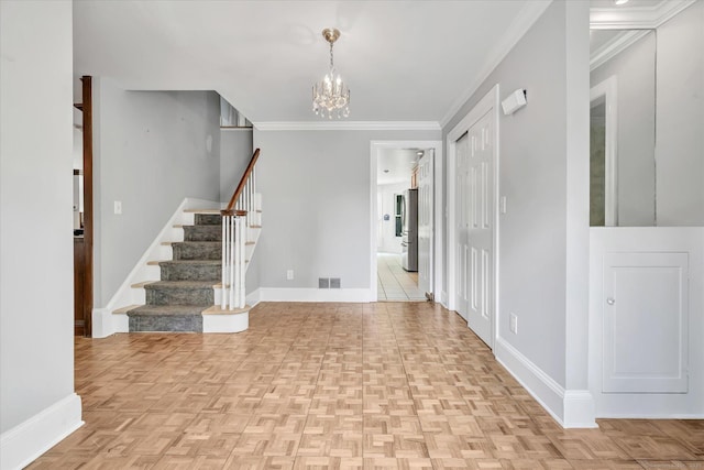 5550 Main St, Stratford, CT 06614 - entryway with stairs, a chandelier, and crown molding