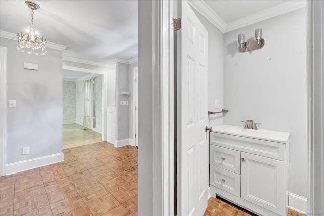 5550 Main St, Stratford, CT 06614 - bathroom with ornamental molding, vanity, and a chandelier