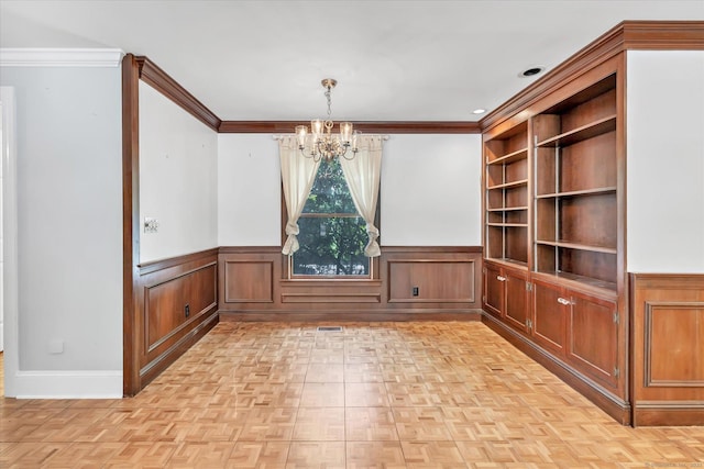 5550 Main St, Stratford, CT 06614 - unfurnished dining area featuring a chandelier, wainscoting, and crown molding