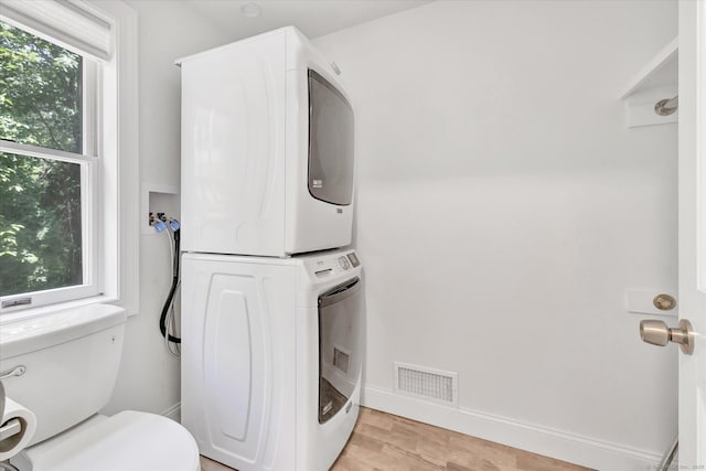 5550 Main St, Stratford, CT 06614 - washroom featuring estacked washer and dryer and light wood finished floors
