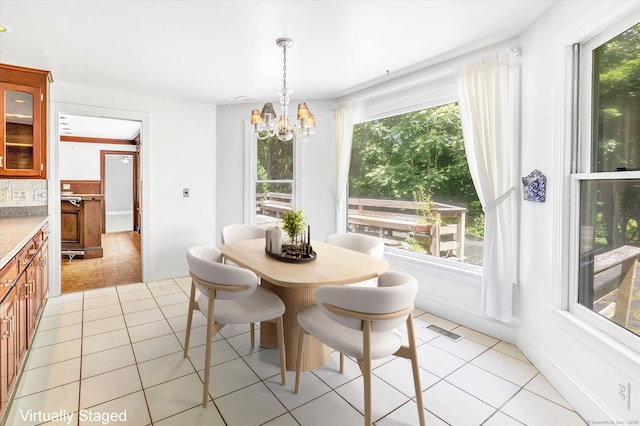 5550 Main St, Stratford, CT 06614 - dining room with a chandelier and light tile patterned floors