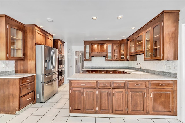 5550 Main St, Stratford, CT 06614 - kitchen featuring stainless steel appliances, light countertops, under cabinet range hood, tasteful backsplash, and recessed lighting