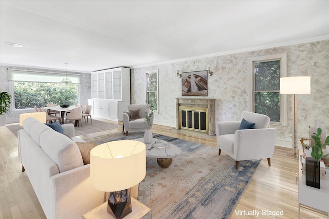 5550 Main St, Stratford, CT 06614 - living room with wallpapered walls, wood finished floors, crown molding, and a high end fireplace