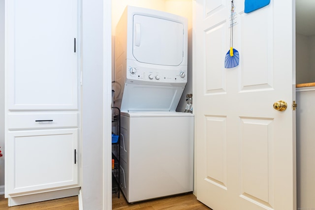 76 Highland Dr Unit 76, Monroe, CT 06468 - laundry room featuring stacked washing machine and dryer and light wood finished floors