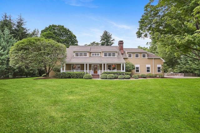 4 Reimer Rd, Westport, CT 06880 - shingle-style home with a porch, a front lawn, and a chimney