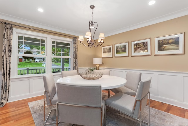 4 Reimer Rd, Westport, CT 06880 - dining room featuring ornamental molding, light wood-style floors, a chandelier, a decorative wall, and wainscoting