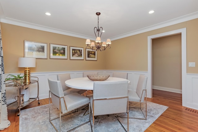 4 Reimer Rd, Westport, CT 06880 - dining room featuring ornamental molding, a wainscoted wall, light wood-style flooring, a chandelier, and recessed lighting