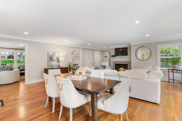 4 Reimer Rd, Westport, CT 06880 - dining area with stairway, plenty of natural light, a glass covered fireplace, ornamental molding, and recessed lighting