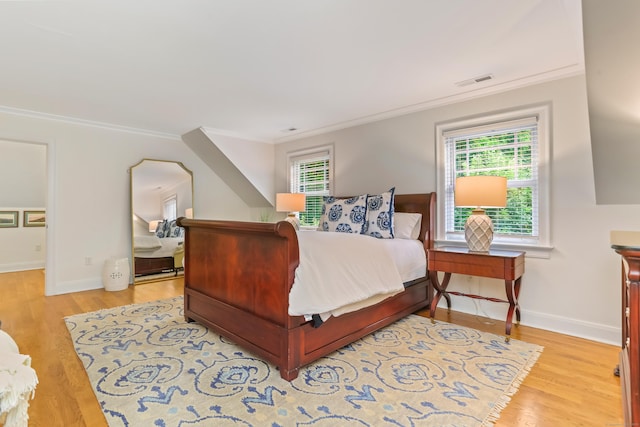 4 Reimer Rd, Westport, CT 06880 - bedroom with ornamental molding, multiple windows, and wood finished floors