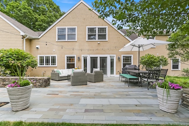 4 Reimer Rd, Westport, CT 06880 - back of house with an outdoor living space, a patio, outdoor dining space, and roof with shingles