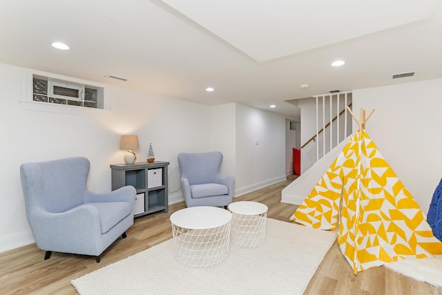 4 Reimer Rd, Westport, CT 06880 - sitting room with wood finished floors, stairway, and recessed lighting