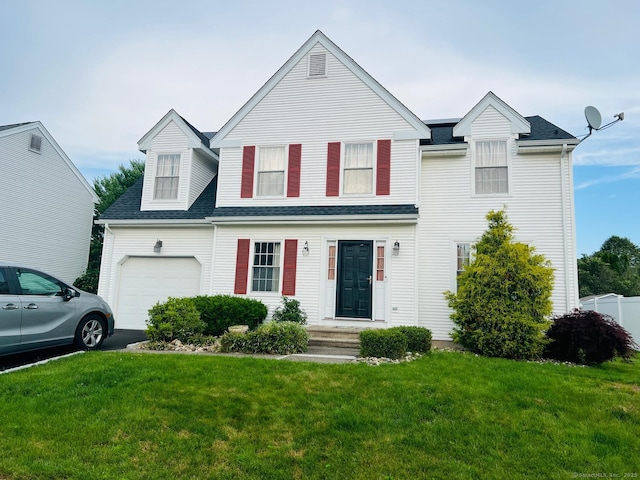 48 Harris Dr, Newington, CT 06111 - traditional-style home featuring a front yard, asphalt driveway, an attached garage, and a shingled roof