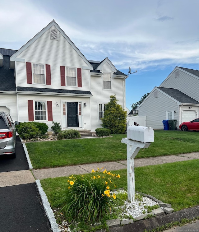 48 Harris Dr, Newington, CT 06111 - view of front of property featuring a front yard and asphalt driveway