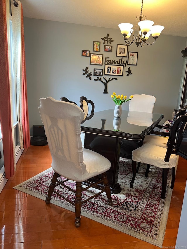 48 Harris Dr, Newington, CT 06111 - dining room with a chandelier and wood finished floors