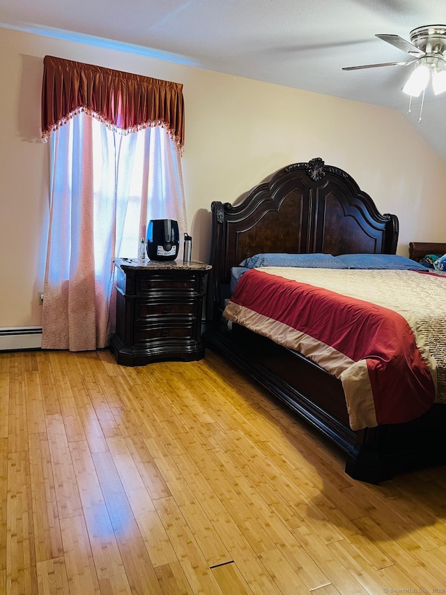 48 Harris Dr, Newington, CT 06111 - bedroom with light wood-style flooring, a baseboard radiator, and a ceiling fan