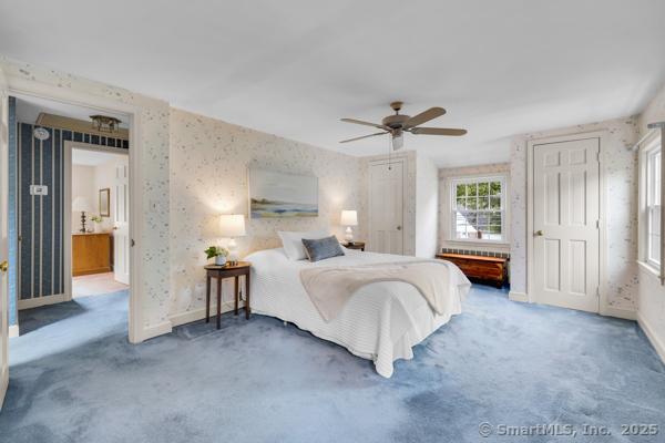 588 Fern St, West Hartford, CT 06107 - carpeted bedroom with wallpapered walls and a ceiling fan