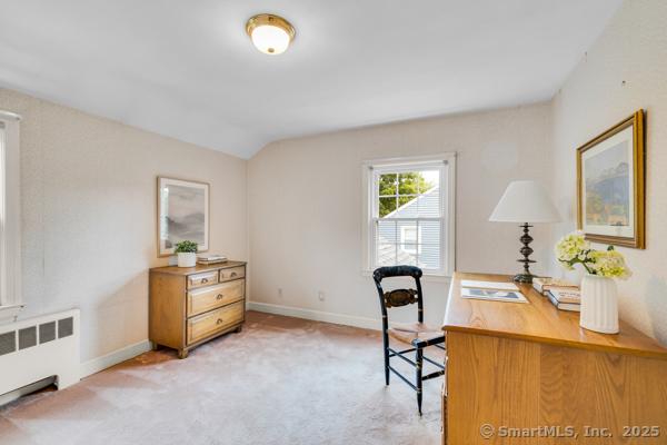 588 Fern St, West Hartford, CT 06107 - office area with radiator, light carpet, and lofted ceiling