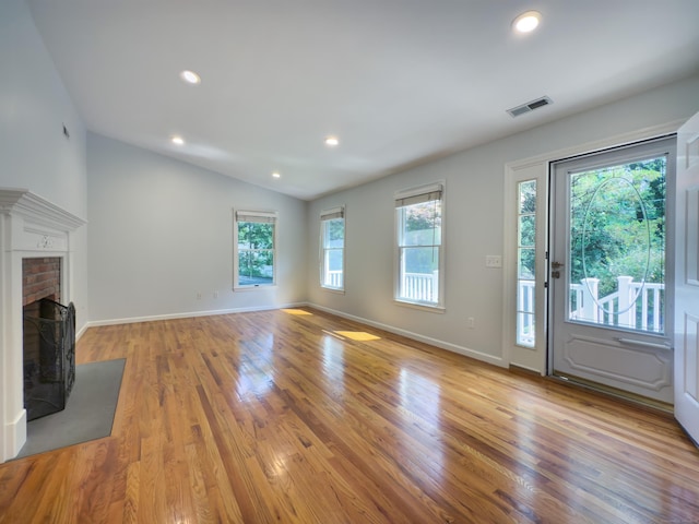 6 Jeffro Dr, Ridgefield, CT 06877 - unfurnished living room featuring wood finished floors, vaulted ceiling, a fireplace, and recessed lighting