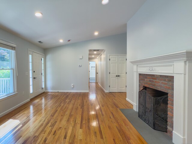 6 Jeffro Dr, Ridgefield, CT 06877 - unfurnished living room featuring a fireplace, light wood finished floors, and recessed lighting