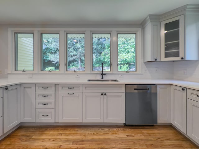 6 Jeffro Dr, Ridgefield, CT 06877 - kitchen with dishwasher, light countertops, glass insert cabinets, and light wood-type flooring