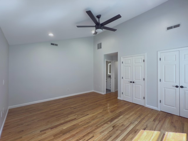 6 Jeffro Dr, Ridgefield, CT 06877 - unfurnished bedroom with multiple closets, high vaulted ceiling, wood finished floors, and ceiling fan