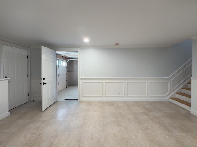 6 Jeffro Dr, Ridgefield, CT 06877 - empty room with a decorative wall, stairway, and wainscoting