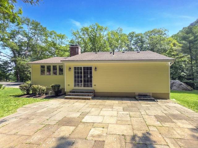 6 Jeffro Dr, Ridgefield, CT 06877 - rear view of house featuring a chimney, entry steps, and a patio