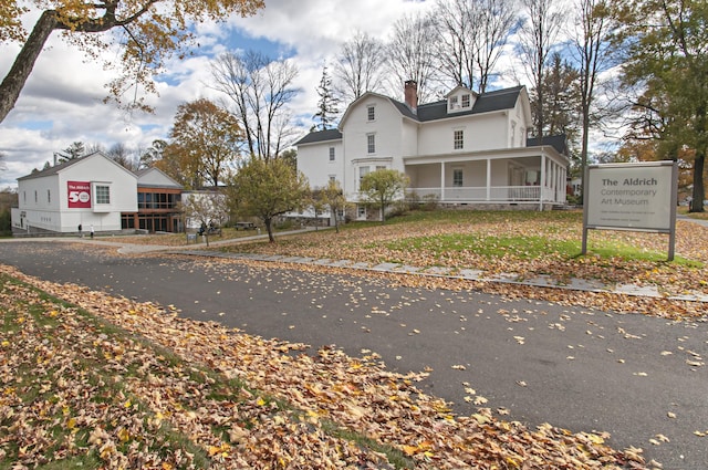 6 Jeffro Dr, Ridgefield, CT 06877 - view of front of house featuring a chimney and covered porch