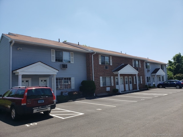 16 Lisa Ct Apt 7, Waterbury, CT 06704 - view of building exterior with uncovered parking