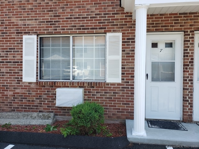 16 Lisa Ct Apt 7, Waterbury, CT 06704 - doorway to property featuring brick siding
