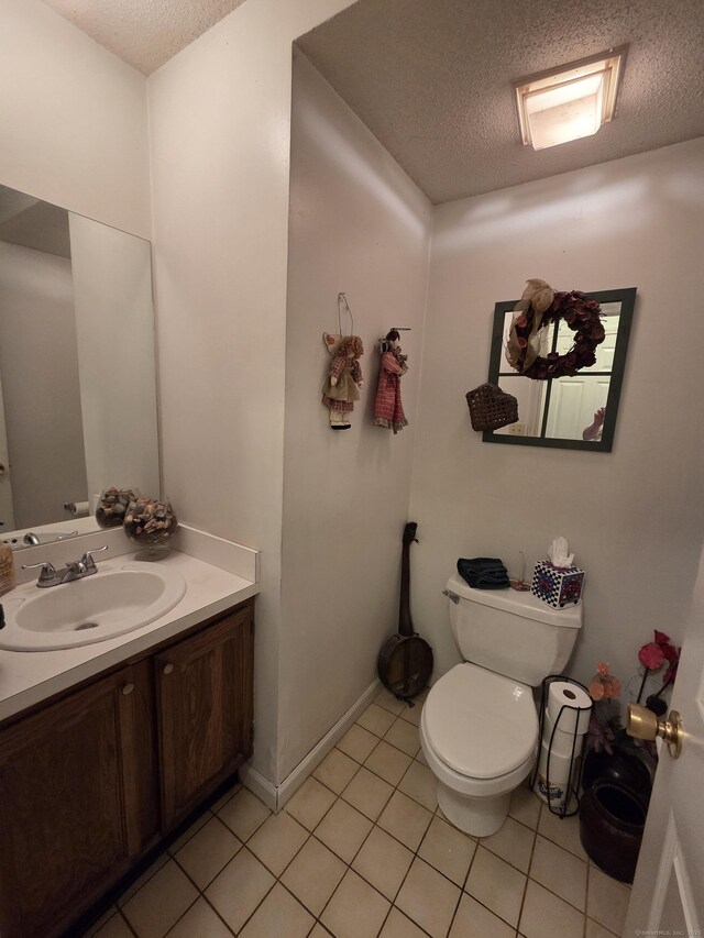 16 Seymour Rd Unit 2C, East Granby, CT 06026 - bathroom with a textured ceiling, vanity, and tile patterned floors