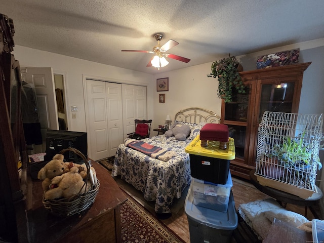 16 Seymour Rd Unit 2C, East Granby, CT 06026 - bedroom featuring a closet, wood finished floors, a ceiling fan, and a textured ceiling