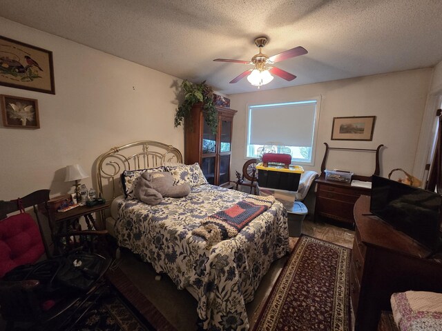 16 Seymour Rd Unit 2C, East Granby, CT 06026 - bedroom featuring a textured ceiling and a ceiling fan