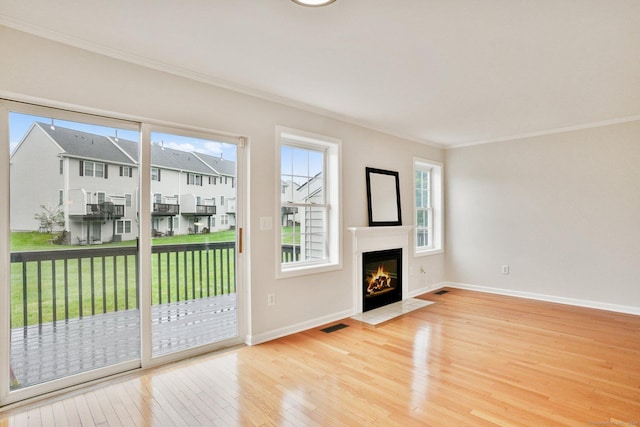 1802 Pinnacle Way Unit 1802, Danbury, CT 06811 - unfurnished living room with wood-type flooring, ornamental molding, a fireplace with flush hearth, and a residential view