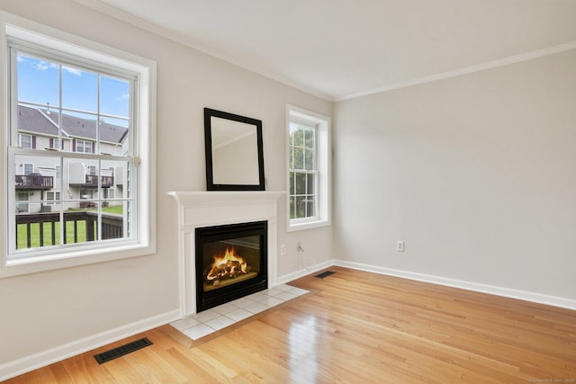 1802 Pinnacle Way Unit 1802, Danbury, CT 06811 - unfurnished living room with wood finished floors, a fireplace with flush hearth, and crown molding