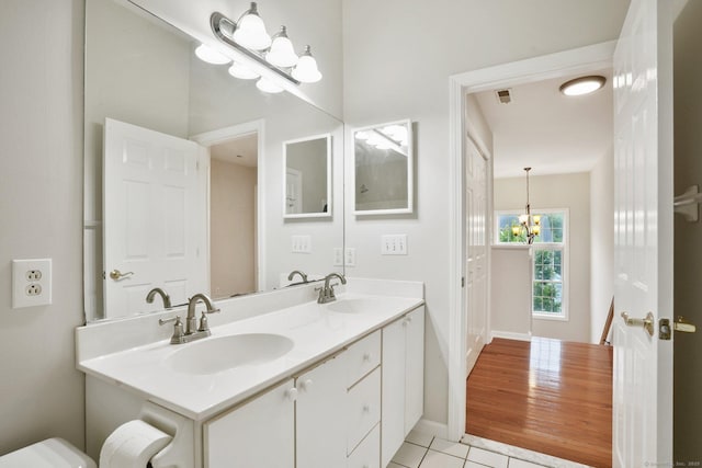 1802 Pinnacle Way Unit 1802, Danbury, CT 06811 - bathroom with double vanity, a chandelier, and tile patterned floors