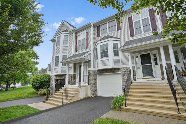 1802 Pinnacle Way Unit 1802, Danbury, CT 06811 - multi unit property featuring stone siding, an attached garage, and asphalt driveway
