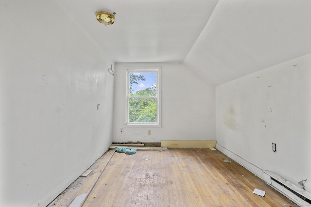 212 Prospect St, Norwich, CT 06360 - additional living space with a baseboard radiator, vaulted ceiling, and hardwood / wood-style flooring