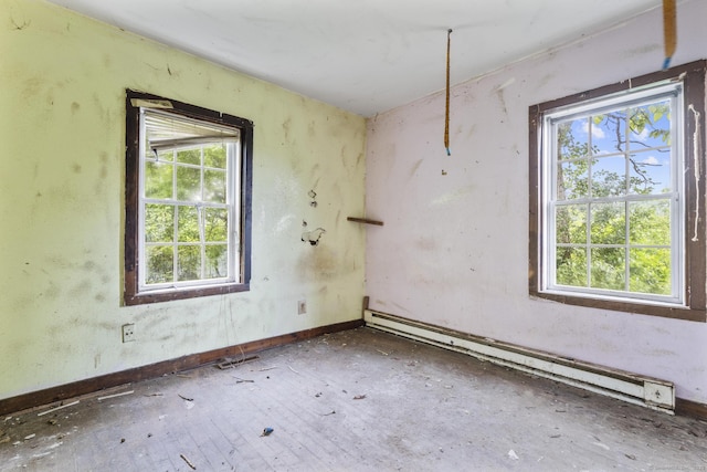 212 Prospect St, Norwich, CT 06360 - empty room with baseboard heating and plenty of natural light